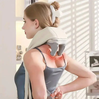 Woman using neck and shoulder massager for relaxation and pain relief at home