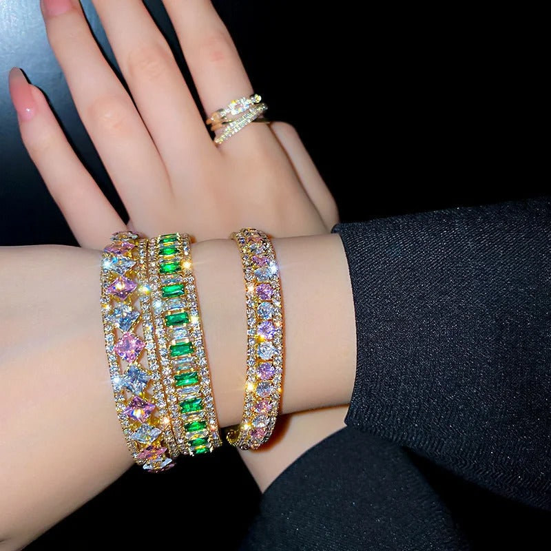 Sparkling gold bangles with colorful gemstones and matching ring, elegant fashion jewelry for women