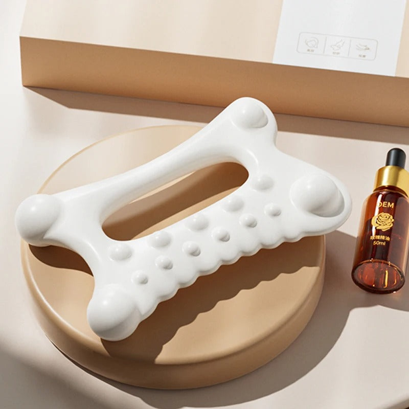White facial massage tool with textured rollers, beauty essential for skincare routine