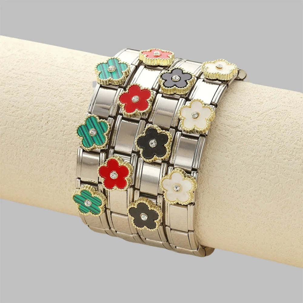 Colorful flower charm bracelet with enamel petals and crystal centers on silver-toned links