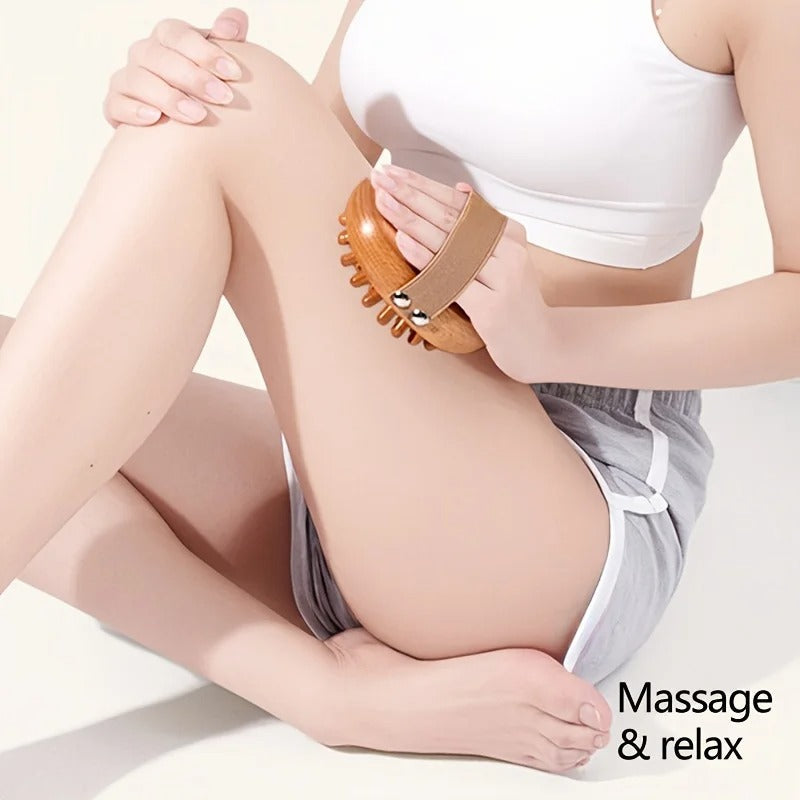 Woman using wooden massage brush for leg relaxation and muscle relief
