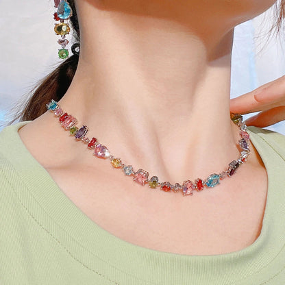 Colorful gemstone necklace with multicolored crystals, worn as a choker on woman's neck, fashion jewelry