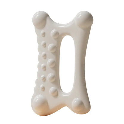 White bone-shaped dog chew toy with textured bumps for dental care